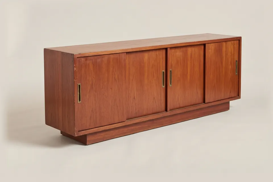 Sideboard, c. 1970. Mahogany with brass handles.